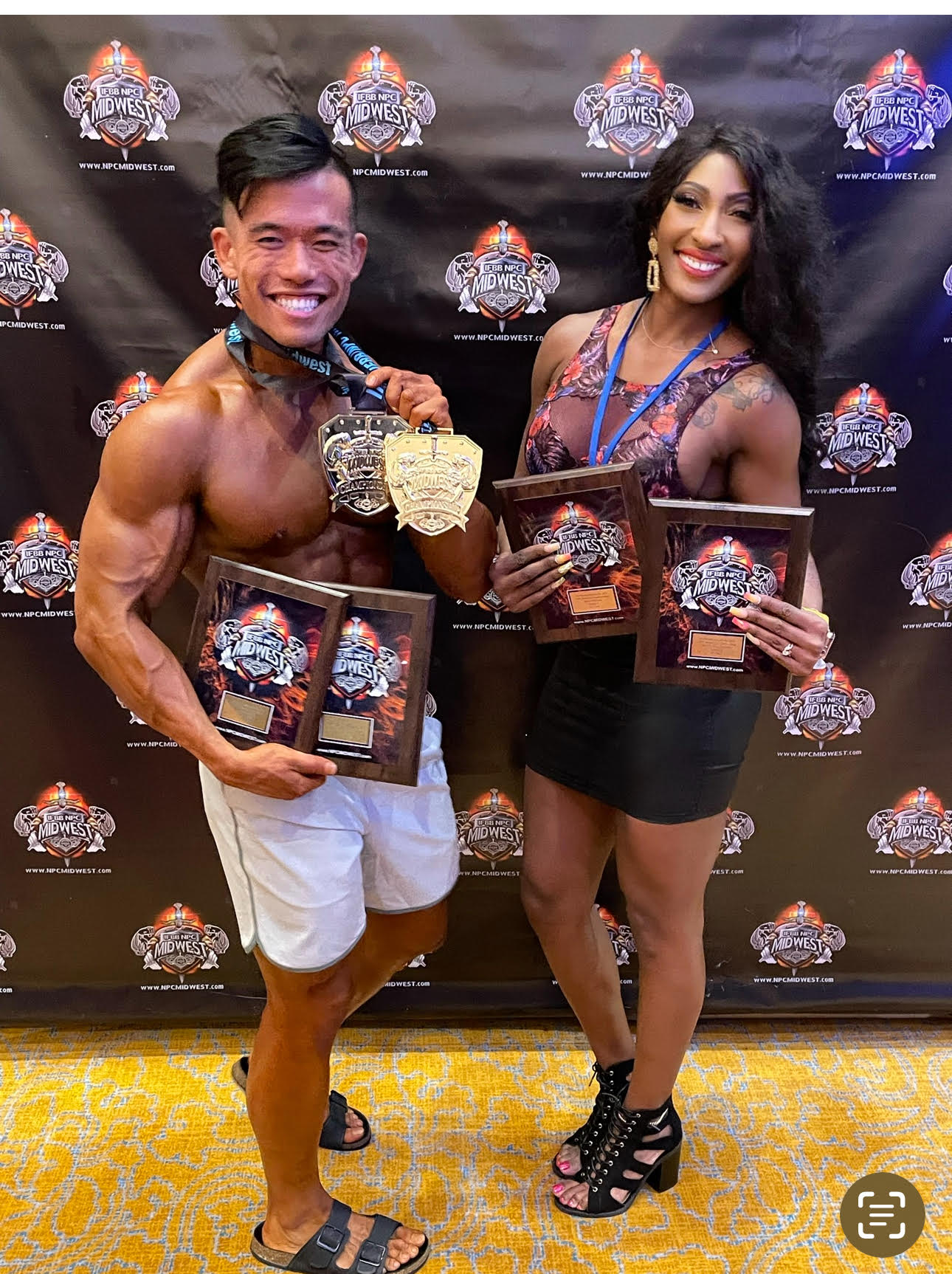 Bodybuilding competitor posing on stage coached by The Hive in Kansas City