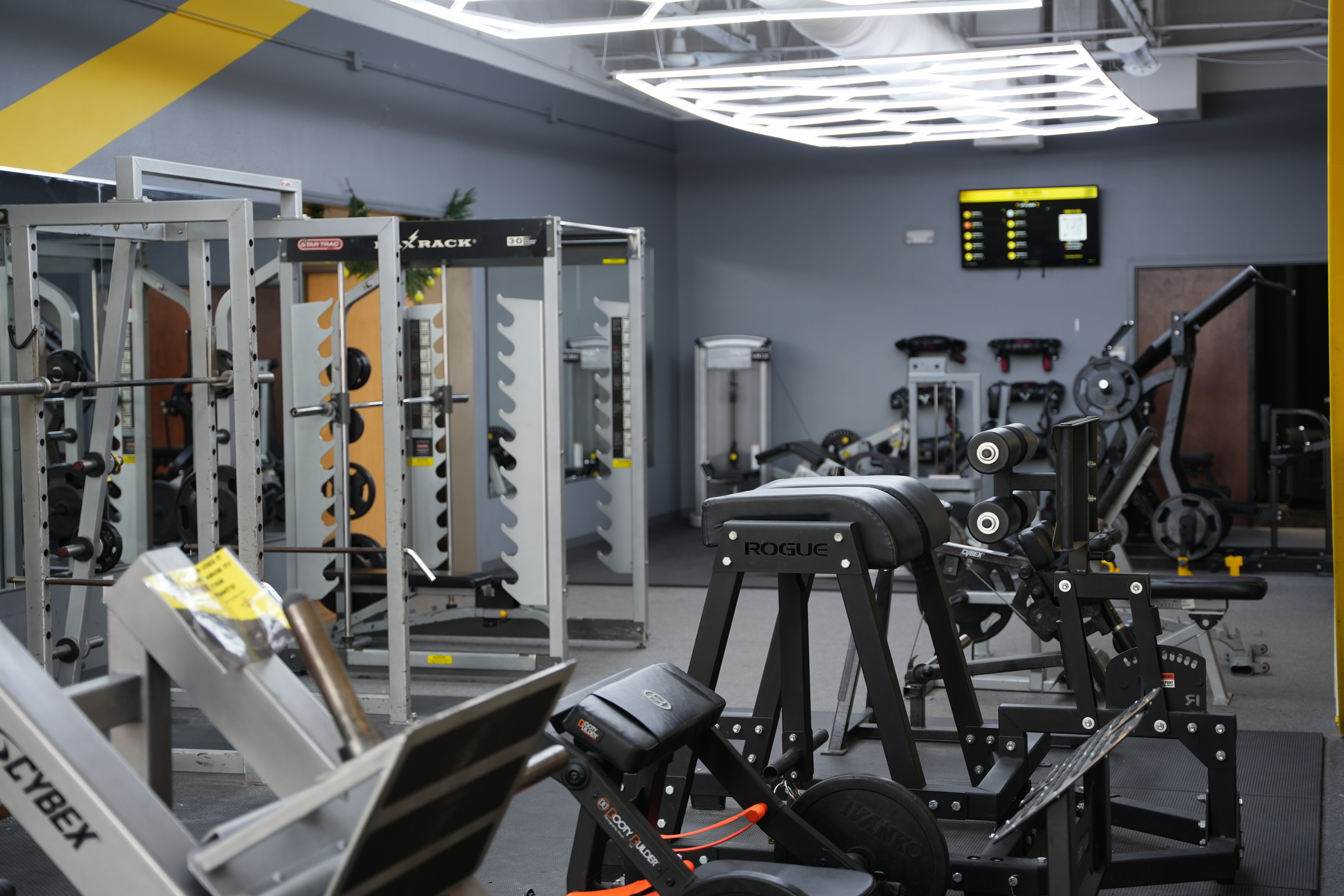 Squat racks and free weight area at Total Body Fitness gym Lees Summit